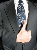 Business man giving thumbs up sign